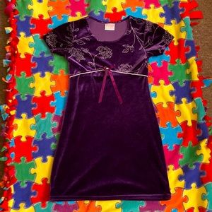 A rich purple velvet dress made for kids. Size 8/10. Good condition no holes